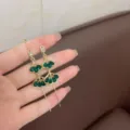 Elegant vintage Korean style gold dangle earrings with green teardrop stones SKU - Emerald Tassel Style (E3061) / Gold