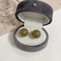 Vintage olive green ball stud earrings displayed in a grey velvet jewelry gift box - Simple Ball Style (E3069) / Gray