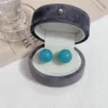 Elegant retro teal round bead stud earrings displayed in a luxury grey velvet jewelry box - Simple Ball Style (E3069) / Blue
