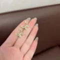 Exquisite gold butterfly ear studs with sparkling rhinestones for elegant women - Hollow Butterfly Style (E2409) / Gold