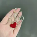 Asymmetric gold-tone heart earrings with crystals and red heart pendant - Asymmetric Heart Earrings (E2559 Gold)