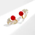 Elegant ginkgo leaf earrings with a red matte bead and a small white pearl in gold finish - Ginkgo Leaf Shape / Matte Red Pearl Gold (E1247)