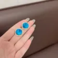 Elegant square stud earrings with faceted blue crystal and rhinestone halo - Rounded Square Stud Earrings (E1371) / Light Blue