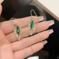 Exquisite leaf-shaped gold earrings featuring emerald green marquise cut stones - Leaf Emerald Tassel Style (E2727 Gold Short Threader) / Gold