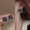 Elegant square black rhinestone stud earrings with a sparkling clear crystal border - Square Contrast Rhinestone Stud Earrings (E1358) / Black & Gold