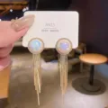 Elegant iridescent pearl dangle earrings with long gold tassel on a display card. - Artificial Pearl Tassel Drop Earrings (925 Silver Post) (E1355) / Gold