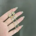 Eleganti orecchini a nappa con fiori dorati in stile coreano e pietre di zirconi. - Stile Nappina Lunga a Fiore a Cinque Petali (E1730) / Oro