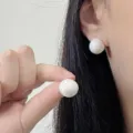 Elegant and minimalist vintage-style white pearl stud earrings for women lifestyle view - Vintage Artificial Pearl Style (E5025) / Gold
