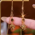 Eleganti orecchini lunghi dorati in stile coreano con cristalli marroni e catene sottili - Stile Nappina Osso di Serpente Cristallo Ambra (E3763) / Oro champagne