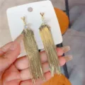 Elegant long gold tassel dangle earrings with sparkling crystal studs fashion variant - V-Shaped Tassel Style / Gold (E3199)