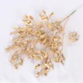 Ramo artificiale oro metallizzato con foglie seghettate per eleganti composizioni floreali - Foglie di Quercia