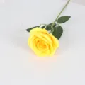 Single yellow silk artificial rose with green leaves for home and wedding decor. - Yellow