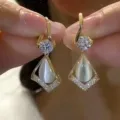 Exquisite Korean style gold earrings featuring white cat eye stones and shimmering cubic zirconia - Rhombus Cat Eye Stone Drop Earrings (E3265) / Gold