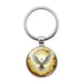 Silver metal keychain featuring a halo peace dove glass cabochon pendant for bags - Silver