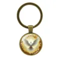 Vintage antique bronze keychain featuring peace dove and halo glass cabochon design - Antique Bronze