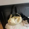 Casual crossbody gym bag in light yellow, versatile toast bag design with black strap. - Yellow
