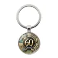 Detailed view of a circular 60th birthday keychain with gold and black decorative patterns - Silver Style (XSWX9416) / Silver