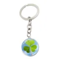 Macro view of a silver keychain with a three-leaf clover glass cabochon pendant - Blue Sky and Clouds Style (XSWX6023-11)