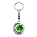 Detailed view of rotating four-leaf clover keychain with moon-shaped silver frame - Clover Style 1 (XSWX6013-1)