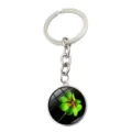 Detailed view of the vibrant green four-leaf clover crystal glass pendant keychain - Shadow and Light Crystal Style (XSWX6023-9)