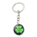 Close-up of a shamrock keychain featuring a crystal glass pendant with green clover - Starry Night Blue Style (XSWX6023-8)
