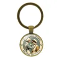 Vintage nurse keychain with 'The Strongest Hearts Belong to Nurses' cabochon - Time Gem Nurse Illustration (XSWX9363) / Antique Bronze