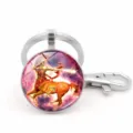 Close-up of Sagittarius zodiac glass cabochon keychain with silver lobster clasp - Sagittarius (XSWX5942)