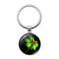Detailed close-up of a lucky four-leaf clover pendant under a smooth glass cabochon. - Clover Style 9 (Silver-9)