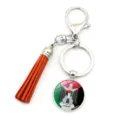 Vue détaillée du porte-clés drapeau de la Palestine avec un pompon orange vif - Style Armoiries (XSWX6158-10)