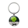Detailed macro view of a lucky four-leaf clover keychain with glass cabochon pendant. - Clover Style 3 (Silver-3) / Silver