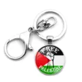 Close-up of circular Palestine flag keychain with Free Palestine text and fist symbol - Fist Free Palestine Slogan Style (XSWX6174-9)