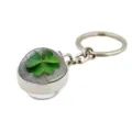 Detail view of a four-leaf clover keychain with a crystal dome for St. Patrick's Day. - Frosted Stone Clover (XSWX6005-10)