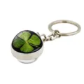 Close-up detail of a silver metal keychain with a lucky four-leaf clover under glass dome - Water Droplet Effect Clover (XSWX6005-6)