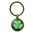Vintage bronze keychain featuring a green shamrock glass cabochon pendant on white - Clover Style 8 (Antique Bronze-8)