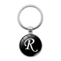 Eleganter silberner Schlüsselanhänger mit schwarzem Glas-Cabochon und dem Buchstaben R - Buchstabe R