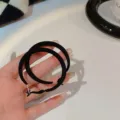 Elegant black flocked hoop earrings for women, stylish winter accessory for daily wear. - Flocked Black Round Hoop Style (E0517)