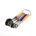 Detail view of stainless steel measuring spoons with colorful silicone handles and ring - Multicolor 5-Piece Measuring Spoon Set
