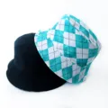 Close-up of black and checkered teal reversible bucket hats for street style - Adult 55-58cm / Argyle Lake Green
