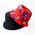 Detailed view of fashionable double-sided bucket hat with vibrant digital print and solid black side. - Style 5