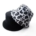 Detailed view of a reversible bucket hat, featuring solid black and chic leopard print. - Adult 55-58cm / Leopard Print Grey