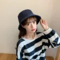 Detailed view of a navy blue Japanese style bucket hat worn by an Asian model - Adult 56-58cm / Bucket Hat Style / Navy Blue