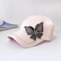 Pink baseball cap detail featuring a rhinestone black mesh butterfly and crystal brim chain. - Adult Adjustable 55-59cm / Butterfly Pink