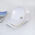 White baseball cap with stylish gold piping and metal M logo detail, perfect for summer sun. - Adult Adjustable 55-59cm / White