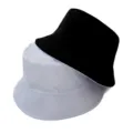 Détail de chapeau bob réversible noir et blanc montrant un tissu doux et ses coutures. - Adulte 55-58cm / Noir et Blanc