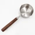 Stainless steel small oil pouring pot with wooden handle and scale marks for kitchen cooking. - 125ml Oil Pot