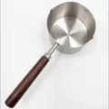 Stainless steel mini oil pouring pot with wooden handle and scale for kitchen cooking. - 250ml Oil Pot