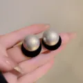 Elegant French stud earrings featuring large grey pearls and black flocked circular bases - Pearl Flocking Base Style (E2668) / Flocked Black
