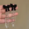 Elegant black velvet bow earrings with long dangling pearl and sparkling crystal fringe - Black Flocked Pearl Rhinestone Long Tassel Style (E2689)