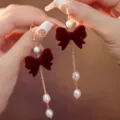 Elegant French style earrings featuring red velvet bows and dangling white pearls - Bow Pearl Chain Ear Hook (E3547) / Gold with Red