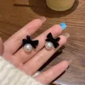 Elegant black flocked bowknot earrings with white pearl accents for autumn and winter - Bowknot Pearl Stud Earrings (E3617) / Black